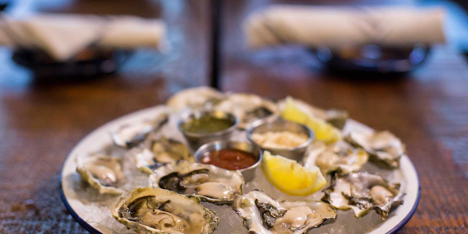 fresh oysters on display over ice