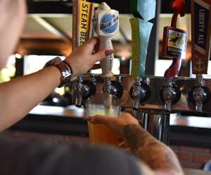 pouring a beer on tap