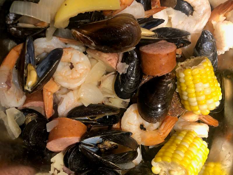 Rustic House Seafood Boil offers pots with fresh local seafood, sausage, veggies and seasonings